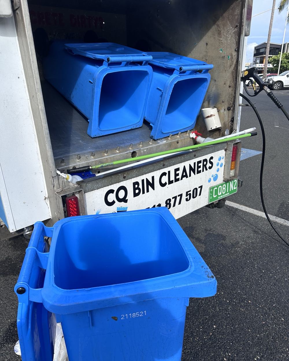 Blue wheelie bins loaded on the CQ Bin Cleaners truck for cleaning